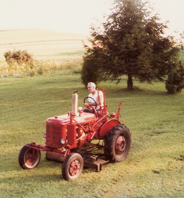 Father mowing with a 1947 Farmall tractor