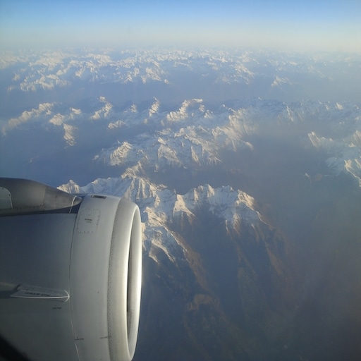 Jet engine as viewed through the window over the Alps