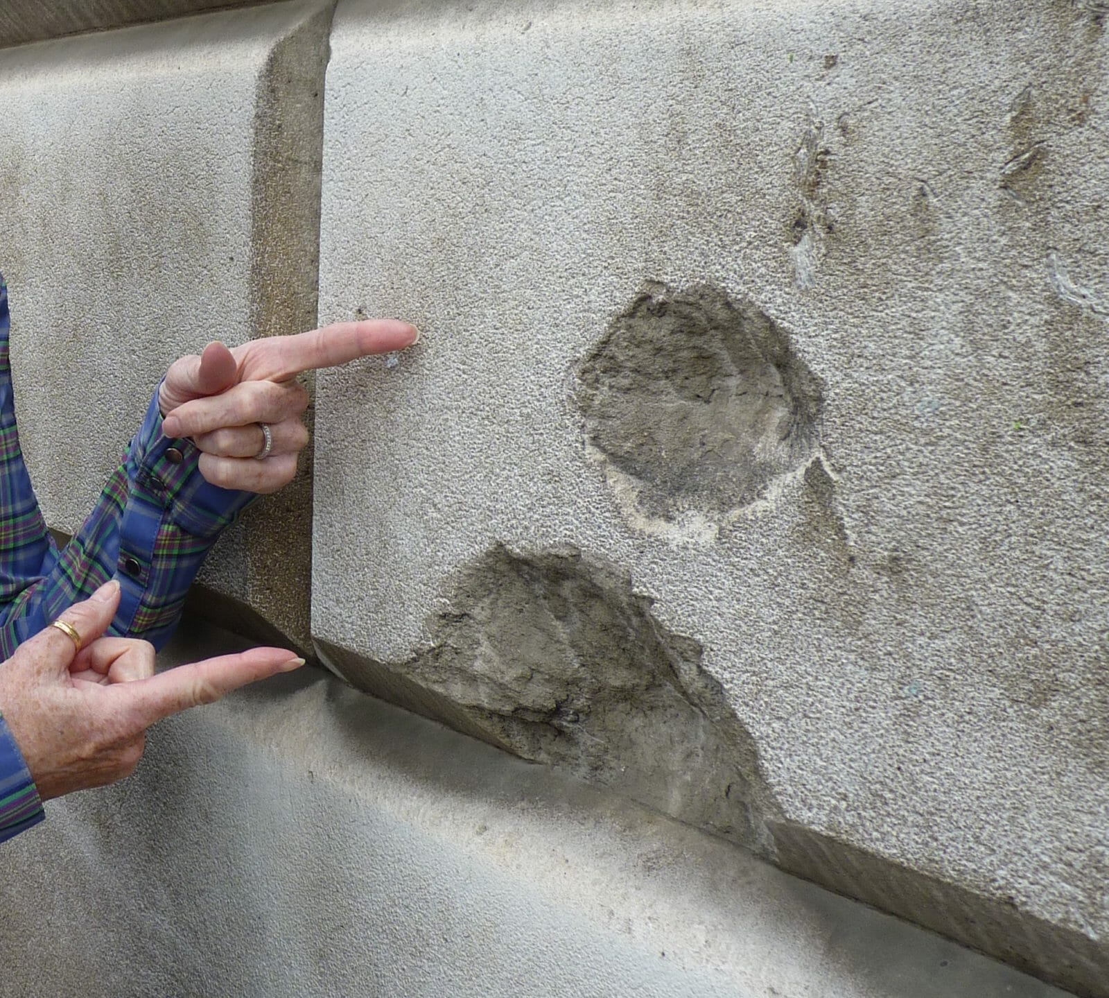 Bomb blasts from WWII on a London Wall