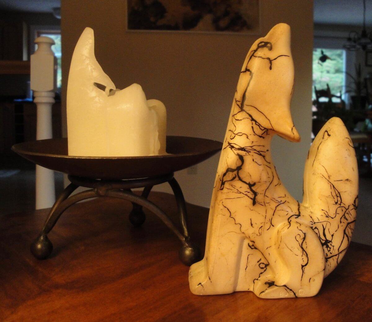 Candle melted to look like a howling coyote statue
