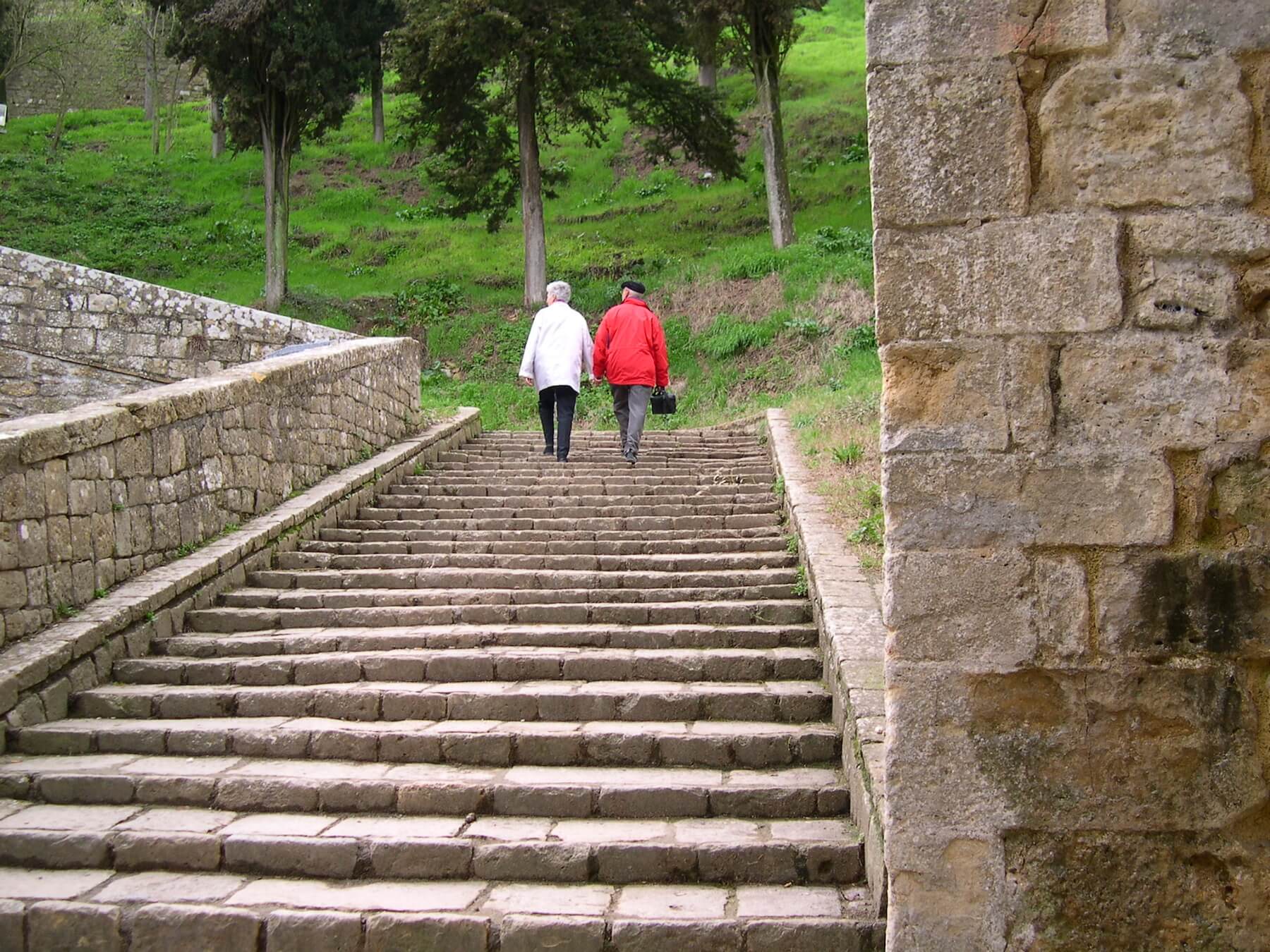 Couple holding hands--marital advice is go to Tuscany