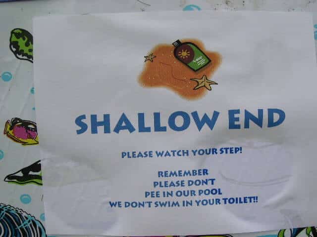 Sign on kiddie pool, "Shallow End"