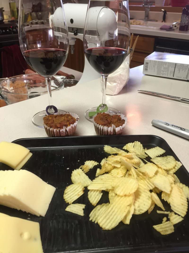 Cheese platter with red wine glasses